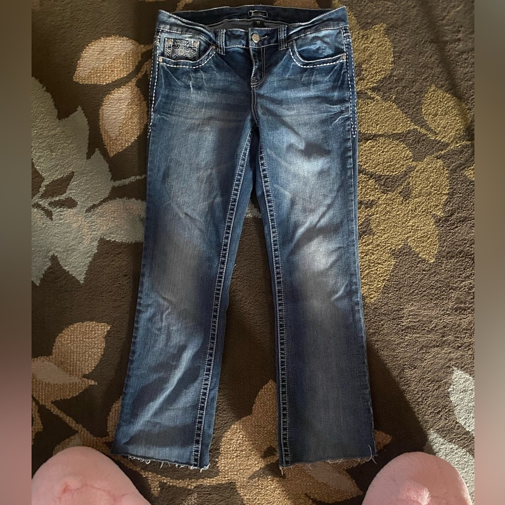 A medium washed color pair of jeans. Size 13 but fits a bit more like a size 12.